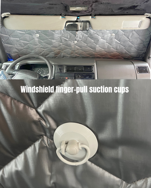 Windshield with finger-pull suction cups attached, showing close-up of the product.