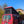 Load image into Gallery viewer, Red ford nugget van with a black rooftop tent replacement freshly installed.
