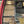 Load image into Gallery viewer, Roll-up tool organizer with tools inside, attached to a car door.
