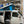 Load image into Gallery viewer, Side view of VW Eurovan Winnebago with 3-window pop-top canvas installed
